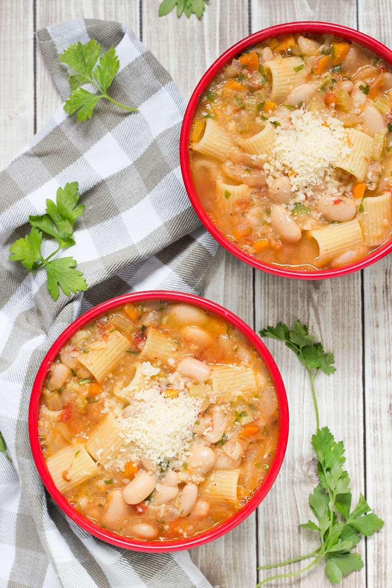 Pasta Fazool, also known by the name Pasta e Fagioli, is a classic Italian pasta and bean soup. It also features Parmesan cheese, tomatoes, and tons of other veggies! | cookingtheglobe.com