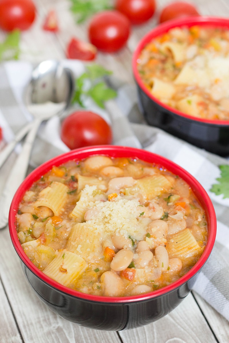 Pasta Fazool, also known by the name Pasta e Fagioli, is a classic Italian pasta and bean soup. It also features Parmesan cheese, tomatoes, and tons of other veggies! | cookingtheglobe.com