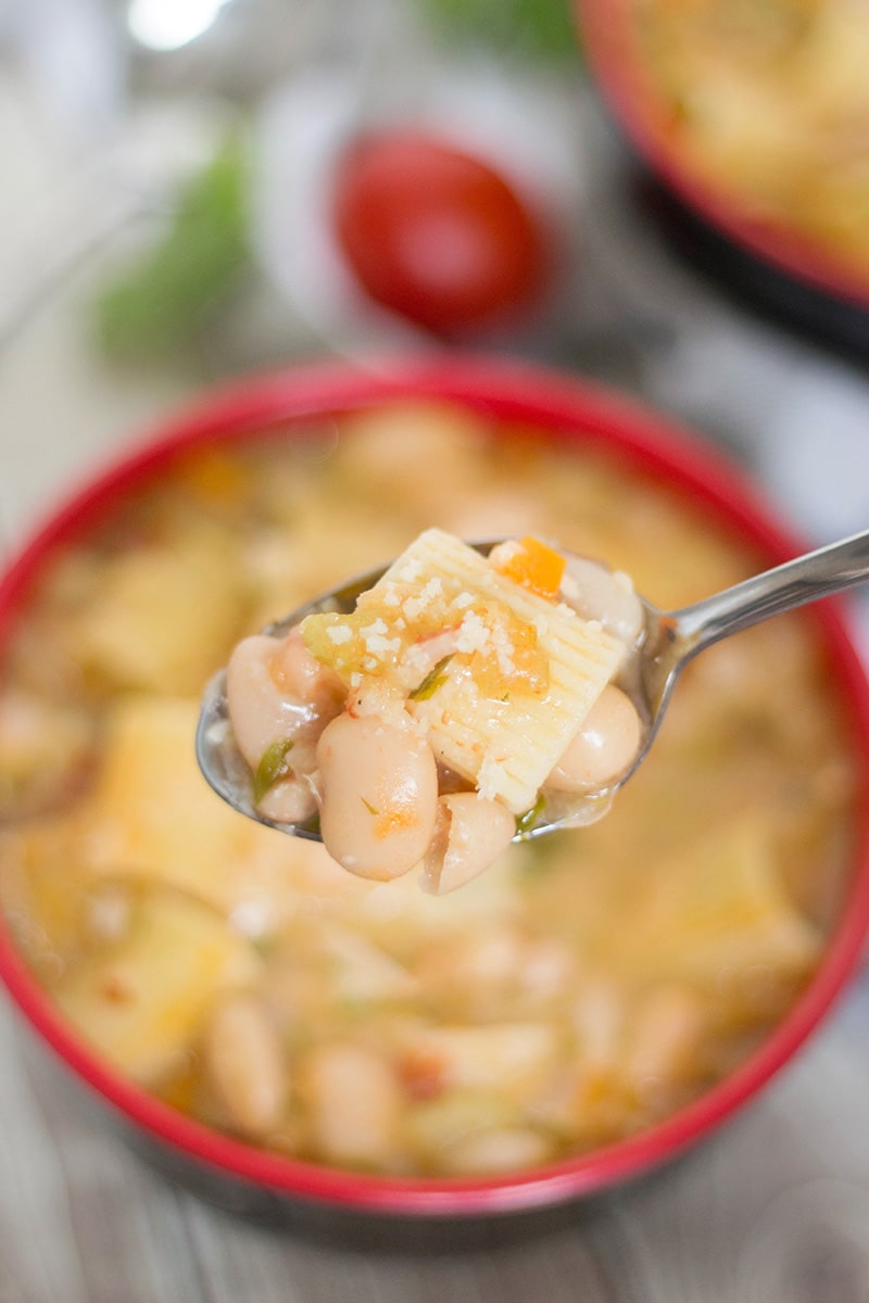 Pasta Fazool, also known by the name Pasta e Fagioli, is a classic Italian pasta and bean soup. It also features Parmesan cheese, tomatoes, and tons of other veggies! | cookingtheglobe.com