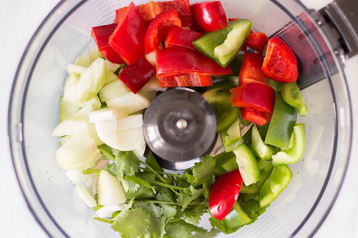 If you have never tried Puerto Rican Sofrito, you don't know what you are missing. This combination of peppers, cilantro, garlic, and onion can be used as a base in many Caribbean dishes! | cookingtheglobe.com