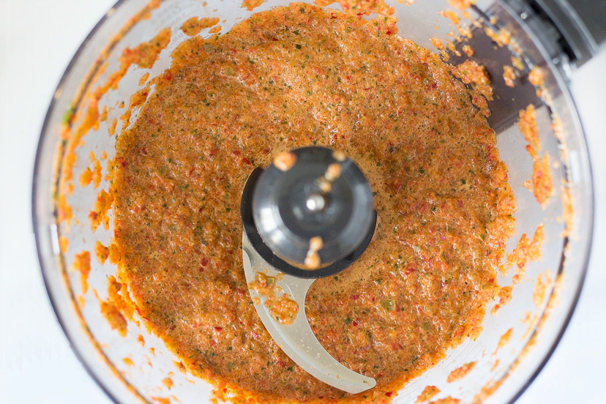 If you have never tried Puerto Rican Sofrito, you don't know what you are missing. This combination of peppers, cilantro, garlic, and onion can be used as a base in many Caribbean dishes! | cookingtheglobe.com