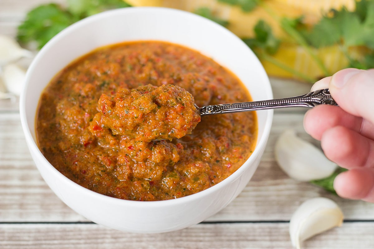 If you have never tried Puerto Rican Sofrito, you don't know what you are missing. This combination of peppers, cilantro, garlic, and onion can be used as a base in many Caribbean dishes! | cookingtheglobe.com