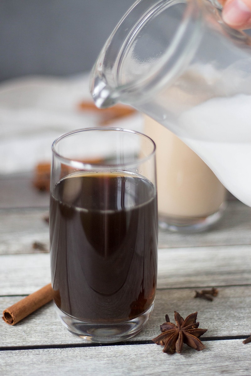 If you are looking for something refreshing and crazy delicious at the same time, this Thai Iced Tea is for you. It's flavored with anise, cinnamon, ginger, cloves, and more! | cookingtheglobe.com