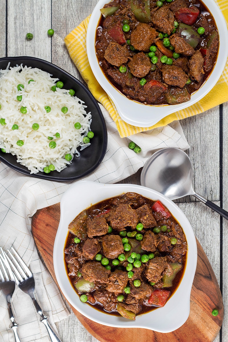 Beef Caldereta is a tomato sauce, red wine, and soy sauce based stew coming from the Philippines. But what sets it apart from other stews is the addition of liver pâté! Intrigued? Check it out! | cookingtheglobe.com