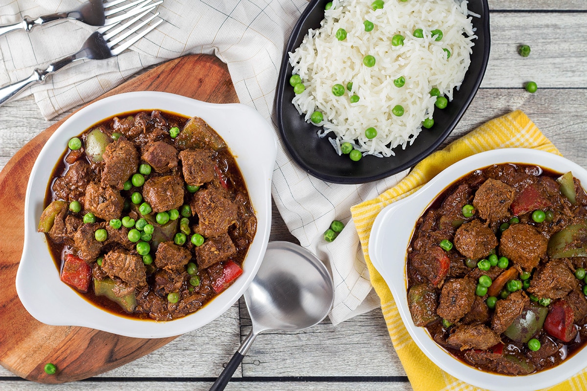 Beef Caldereta is a tomato sauce, red wine, and soy sauce based stew coming from the Philippines. But what sets it apart from other stews is the addition of liver pâté! Intrigued? Check it out! | cookingtheglobe.com