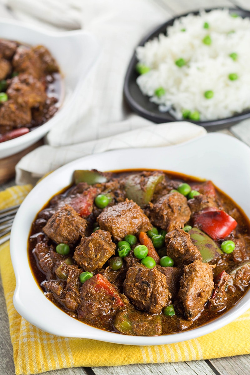 Beef Caldereta is a tomato sauce, red wine, and soy sauce based stew coming from the Philippines. But what sets it apart from other stews is the addition of liver pâté! Intrigued? Check it out! | cookingtheglobe.com