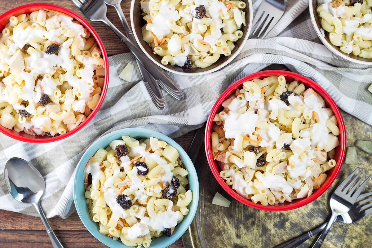 This Filipino Macaroni Salad is not the one you are used to. It features pineapple, raisins, and condensed milk. Mildly sweet, creamy, comforting - you'll love it! | cookingtheglobe.com