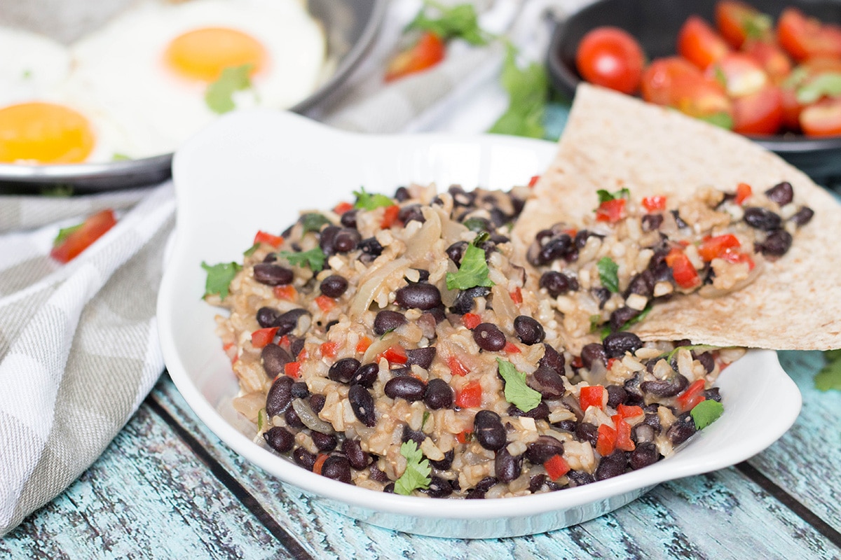 If you have never tried Gallo Pinto before, you don't know what you are missing. This Costa Rican Rice and Beans recipe will leave you craving for more! #vegan | cookingtheglobe.com