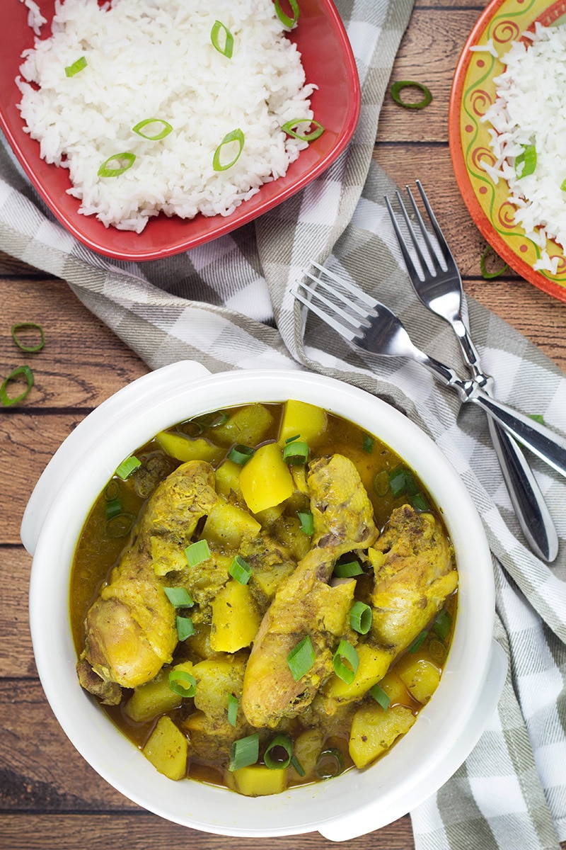 If you love Caribbean cuisine, this Jamaican Curry Chicken will make your taste buds tingle. It's spicy, it's comforting, it's everything you want a dish to be. Yum! | cookingtheglobe.com