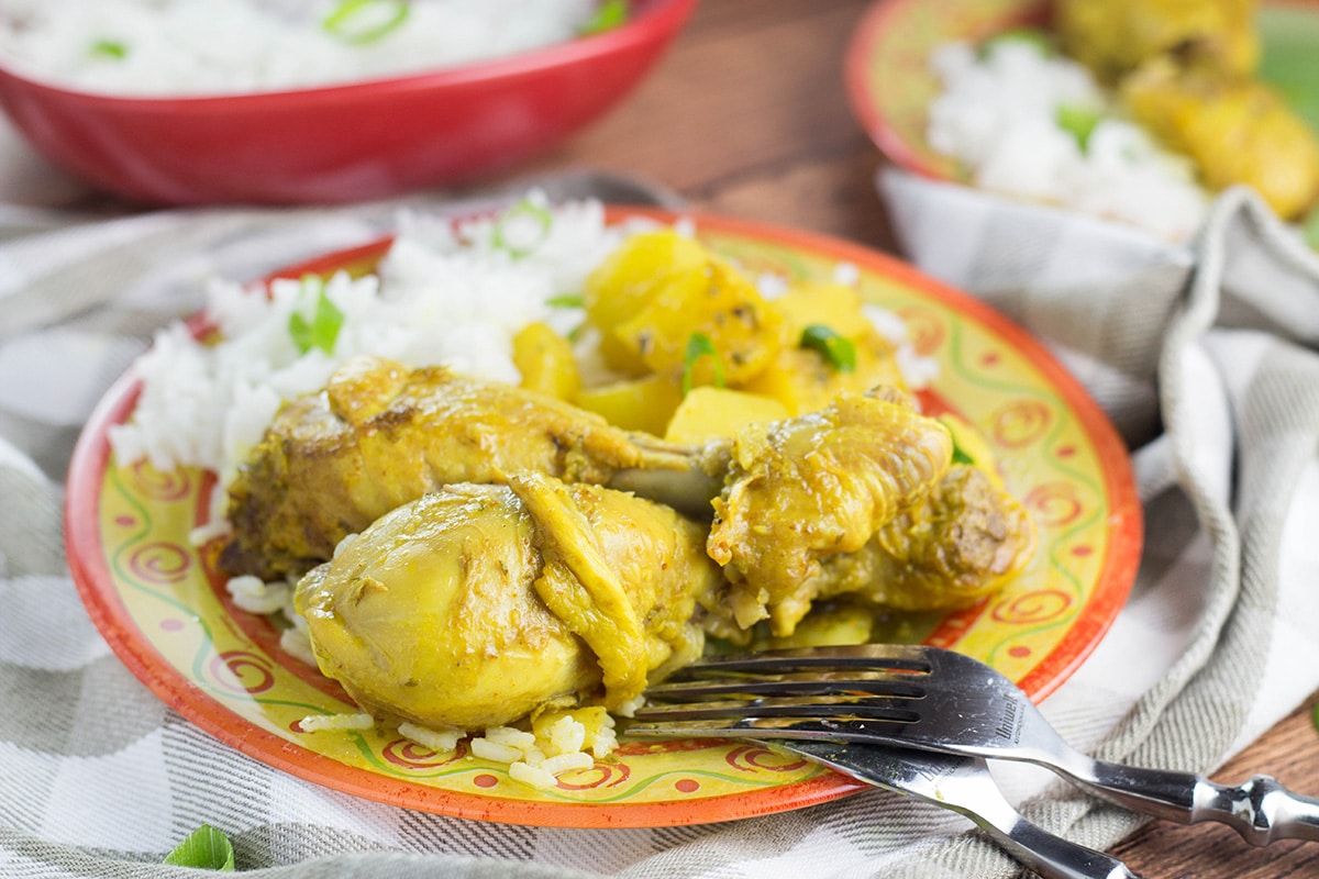 If you love Caribbean cuisine, this Jamaican Curry Chicken will make your taste buds tingle. It's spicy, it's comforting, it's everything you want a dish to be. Yum! | cookingtheglobe.com