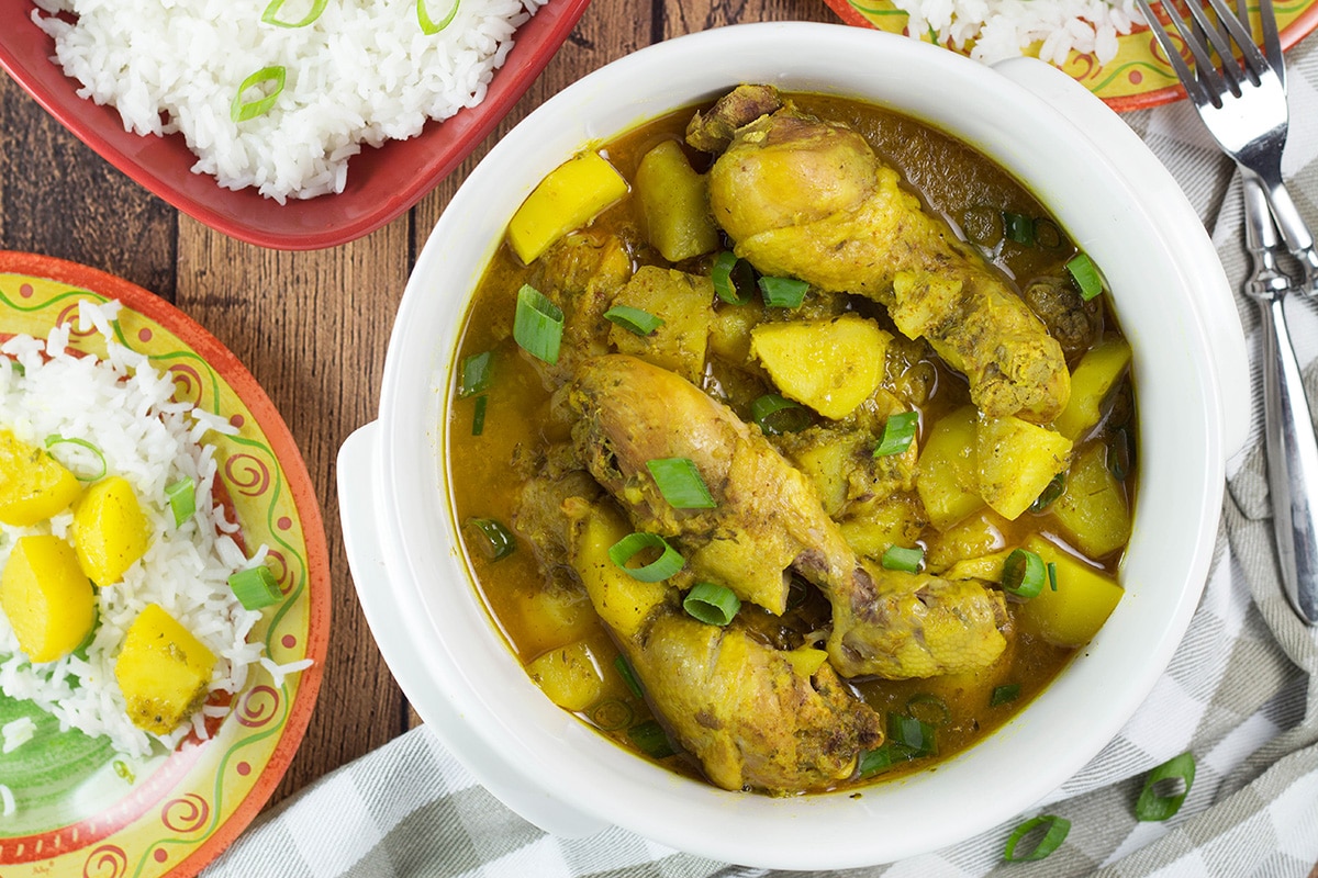 If you love Caribbean cuisine, this Jamaican Curry Chicken will make your taste buds tingle. It's spicy, it's comforting, it's everything you want a dish to be. Yum! | cookingtheglobe.com