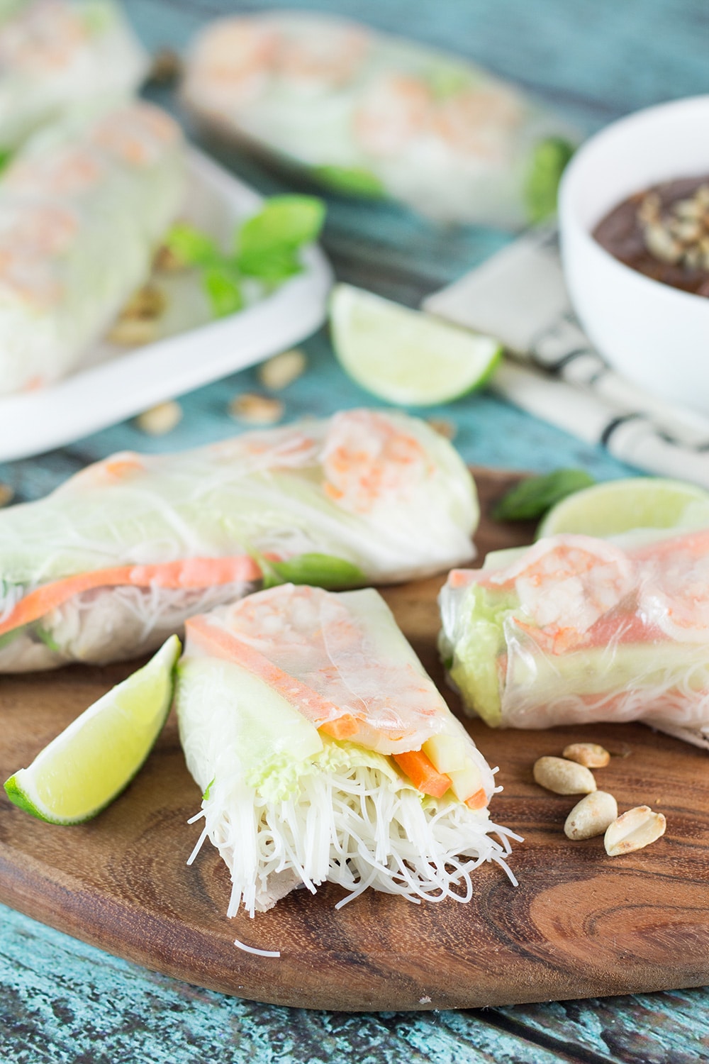 These fresh Vietnamese Spring Rolls (Goi Cuon) are stuffed with pork, shrimp, veggies, and rolled with rice paper. Served with crazy delicious peanut sauce, they make a perfect appetizer or snack! | cookingtheglobe.com