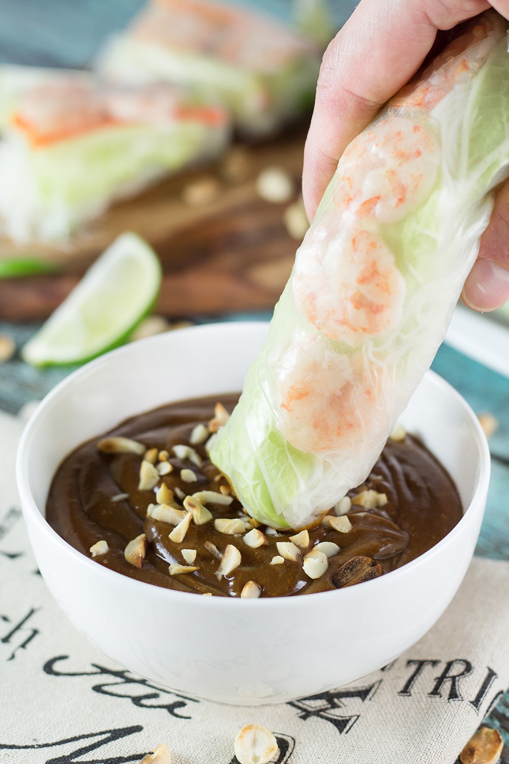 These fresh Vietnamese Spring Rolls (Goi Cuon) are stuffed with pork, shrimp, veggies, and rolled with rice paper. Served with crazy delicious peanut sauce, they make a perfect appetizer or snack! | cookingtheglobe.com