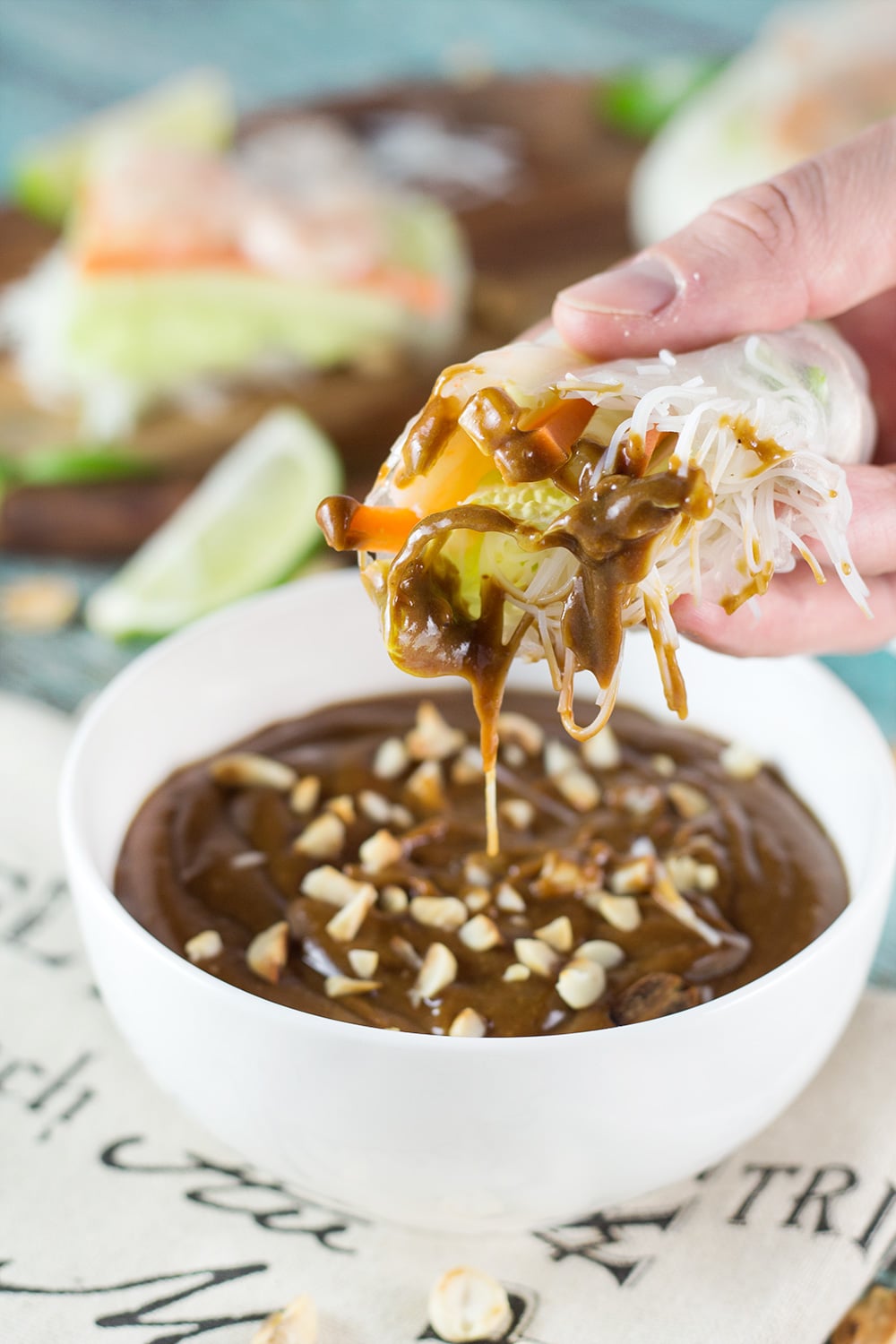 These fresh Vietnamese Spring Rolls (Goi Cuon) are stuffed with pork, shrimp, veggies, and rolled with rice paper. Served with crazy delicious peanut sauce, they make a perfect appetizer or snack! | cookingtheglobe.com