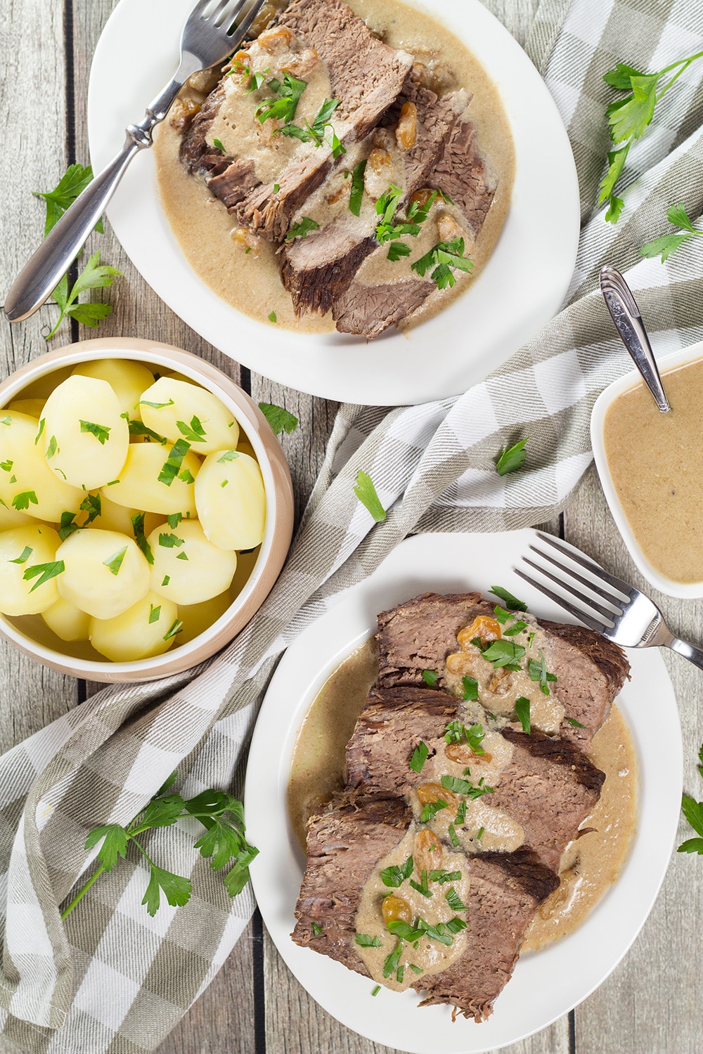 Sauerbraten is a signature German dish often served on Christmas. It's the fork-tender pot roast drowned in a fantastic sweet & sour gravy! | cookingtheglobe.com
