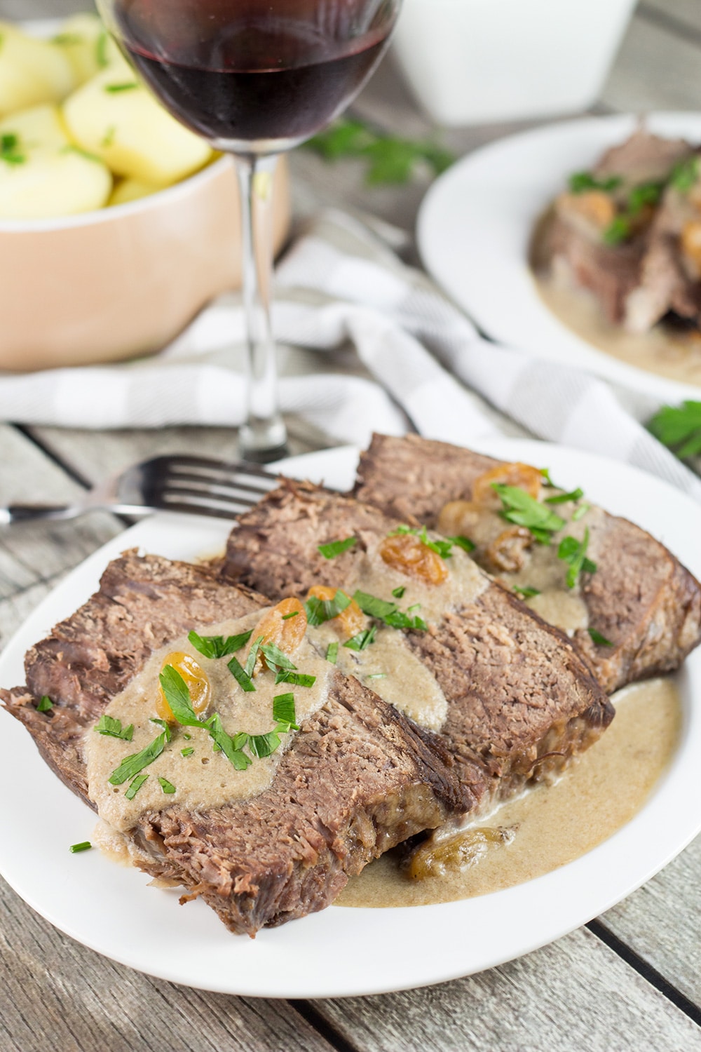 Sauerbraten is a signature German dish often served on Christmas. It's the fork-tender pot roast drowned in a fantastic sweet & sour gravy! | cookingtheglobe.com