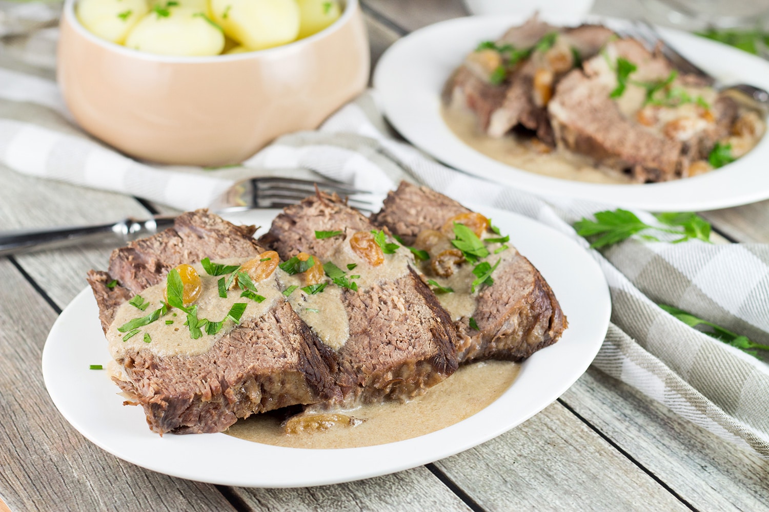 Sauerbraten is a signature German dish often served on Christmas. It's the fork-tender pot roast drowned in a fantastic sweet & sour gravy! | cookingtheglobe.com