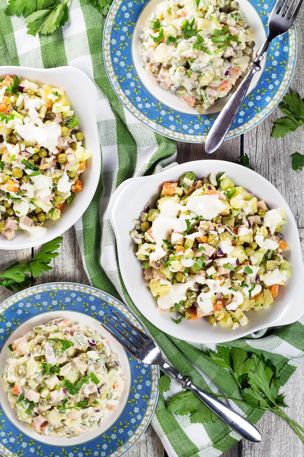 Olivier Salad, also known as Russian Potato Salad, is one of the most famous Russian foods. It is hearty, comforting, filling, and super delicious! | cookingtheglobe.com