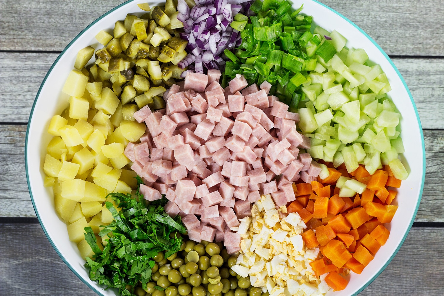 Olivier Salad, also known as Russian Potato Salad, is one of the most famous Russian foods. It is hearty, comforting, filling, and super delicious! | cookingtheglobe.com