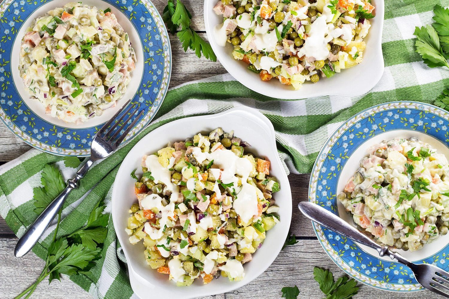 Olivier Salad, also known as Russian Potato Salad, is one of the most famous Russian foods. It is hearty, comforting, filling, and super delicious! | cookingtheglobe.com