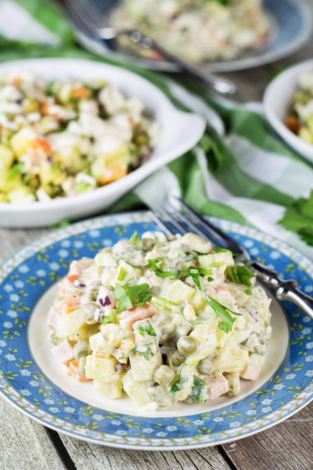 Olivier Salad, also known as Russian Potato Salad, is one of the most famous Russian foods. It is hearty, comforting, filling, and super delicious! | cookingtheglobe.com