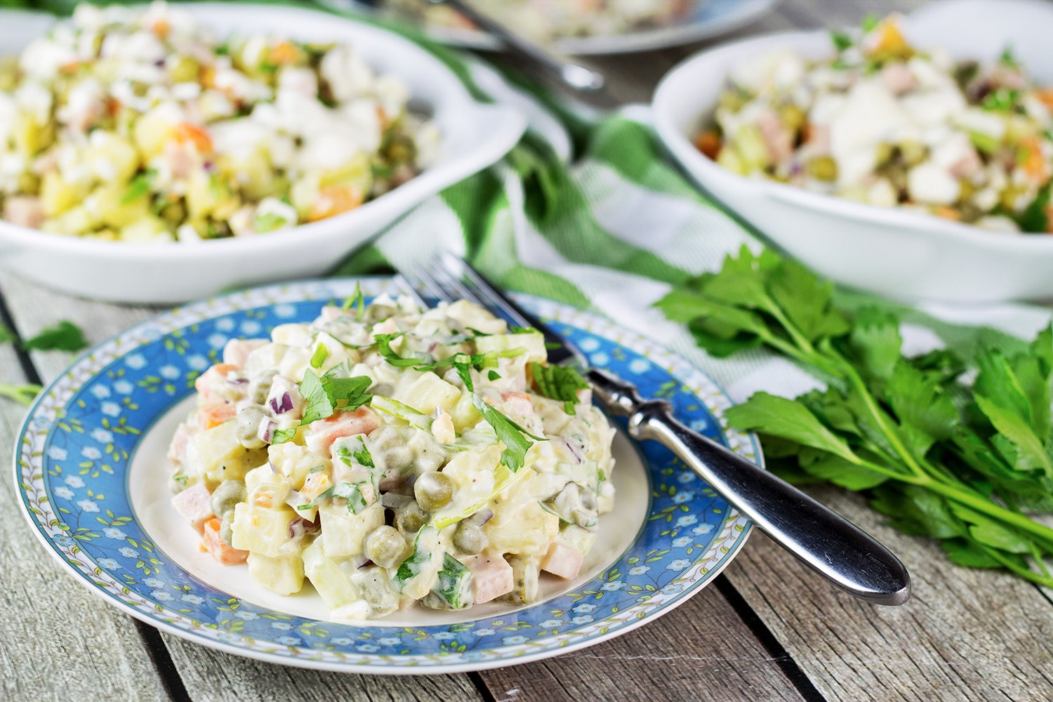 Olivier Salad, also known as Russian Potato Salad, is one of the most famous Russian foods. It is hearty, comforting, filling, and super delicious! | cookingtheglobe.com