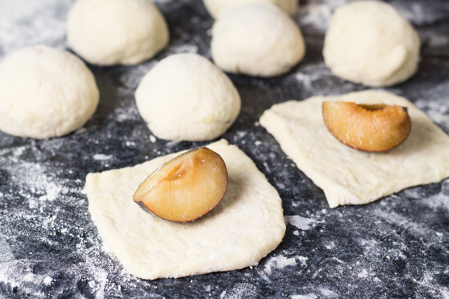 If you love gnocchi, you have to try these Hungarian Plum Dumplings! Made with mashed potatoes and featuring a plum inside, they make a great dessert or a side dish! | cookingtheglobe.com