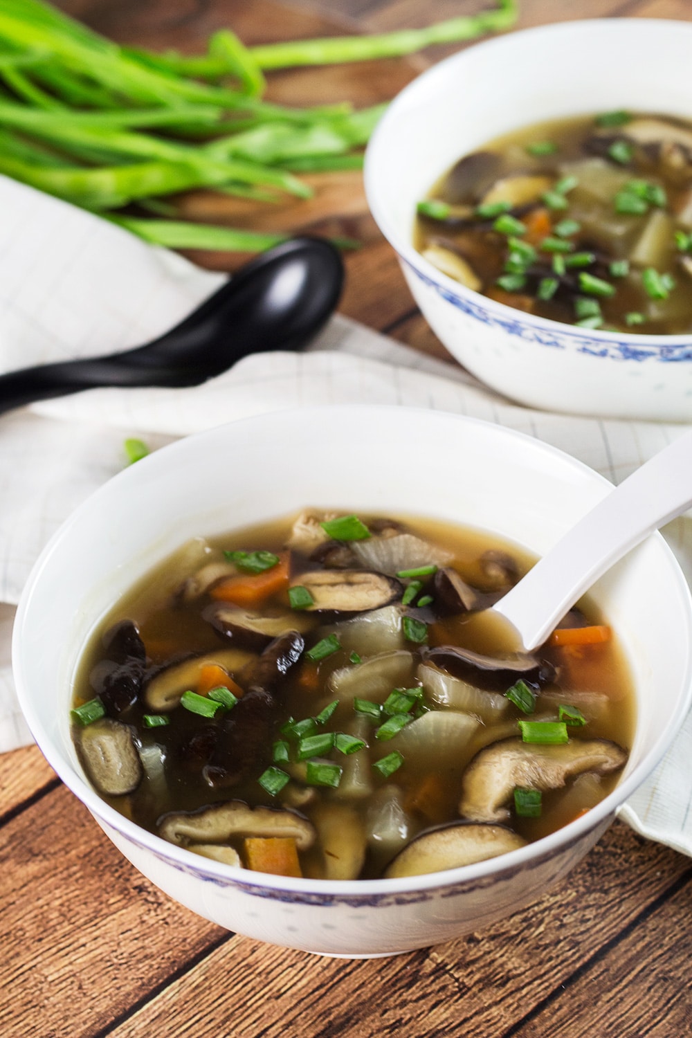 This Japanese Clear Soup uses a flavorful dashi stock as a base and also features shiitake mushrooms and a bunch of veggies! A perfect appetizer or a light lunch! | cookingtheglobe.com