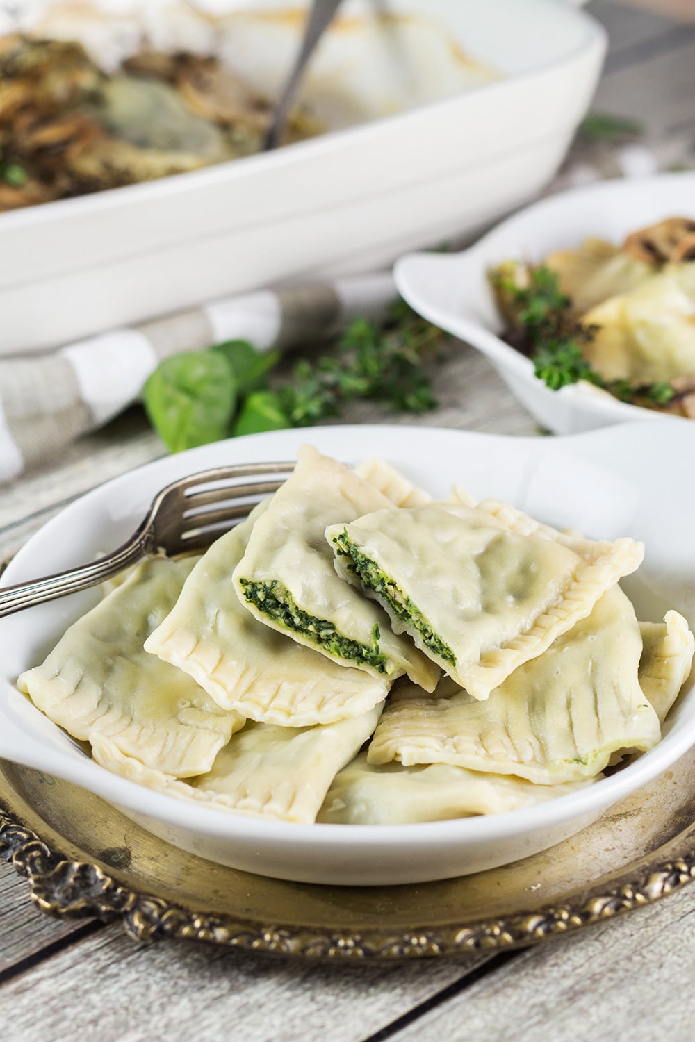 Maultaschen is a German version of Italian ravioli dumplings, only way bigger. This recipe features two different fillings: a traditional and a modern one! | cookingtheglobe.com