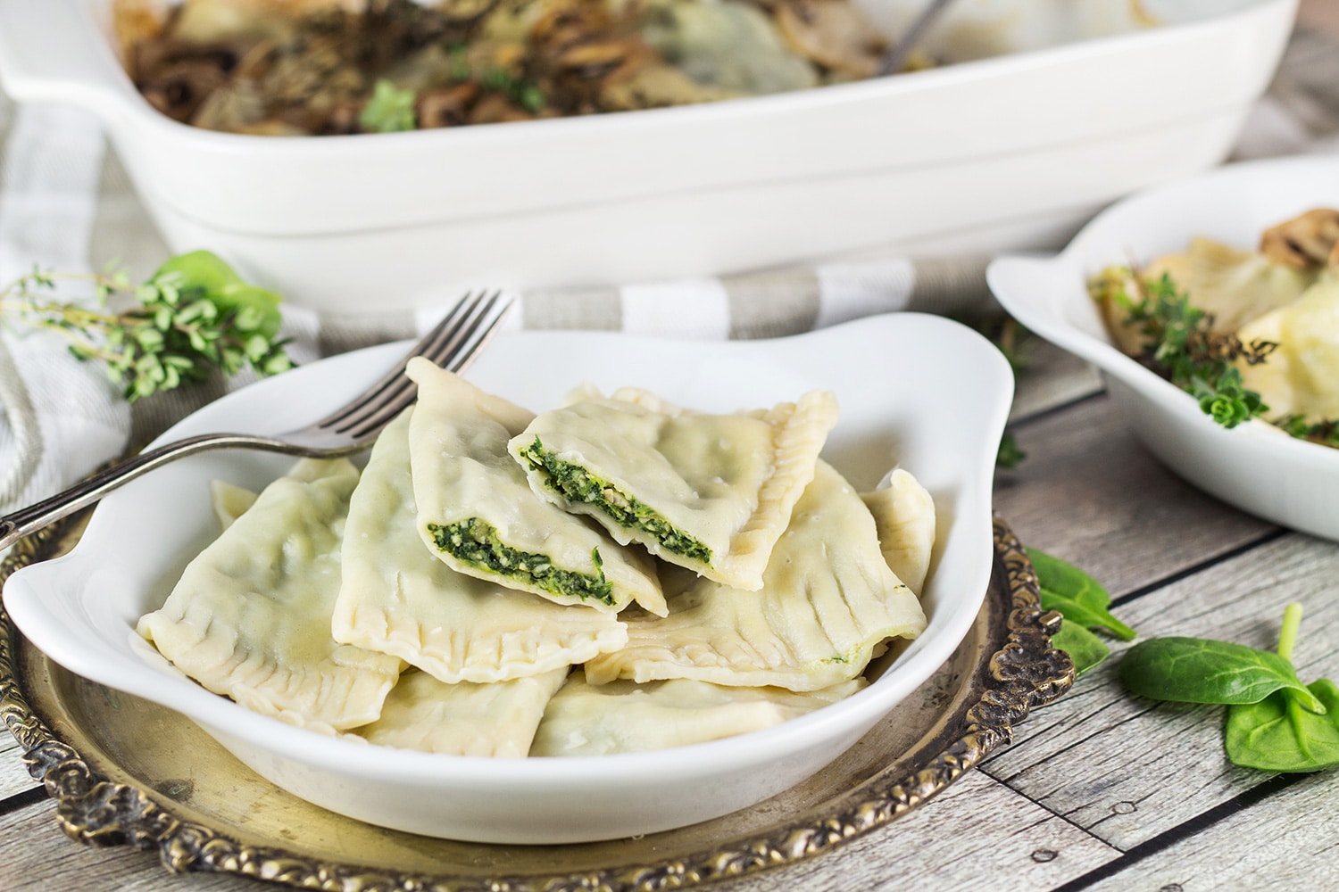 Maultaschen is a German version of Italian ravioli dumplings, only way bigger. This recipe features two different fillings: a traditional and a modern one! | cookingtheglobe.com