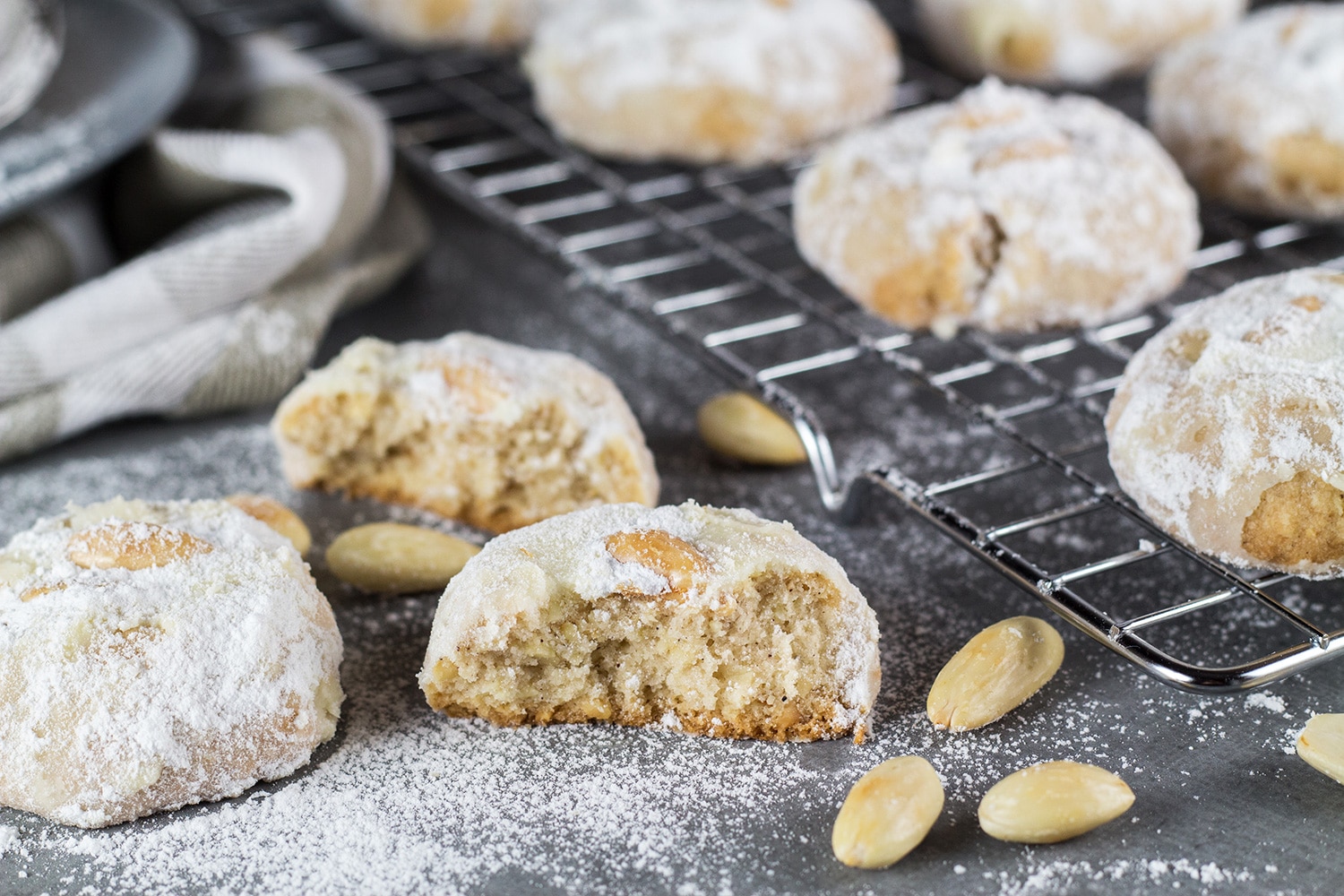 These Mexican Wedding Cookies are buttery, crumbly, nutty, and topped with whole almonds. Perfect with a mug of hot cocoa or a cup of milk, tea, or coffee! | cookingtheglobe.com