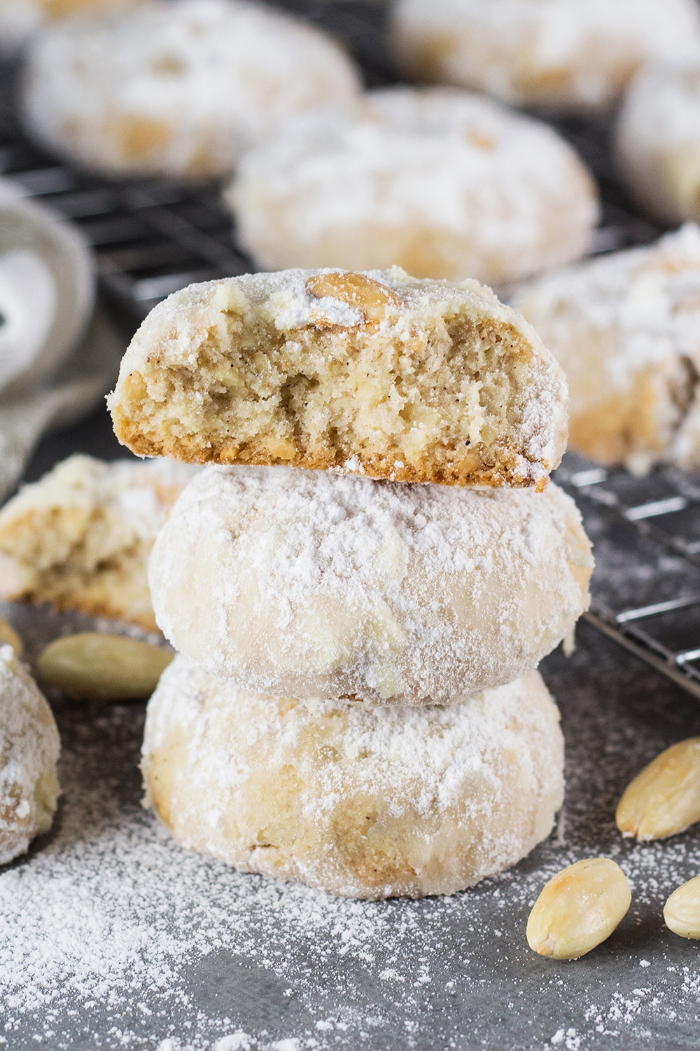These Mexican Wedding Cookies are buttery, crumbly, nutty, and topped with whole almonds. Perfect with a mug of hot cocoa or a cup of milk, tea, or coffee! | cookingtheglobe.com
