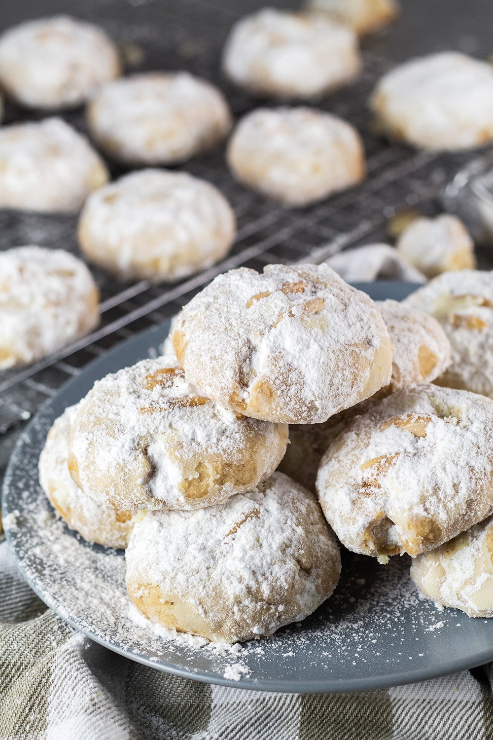 These Mexican Wedding Cookies are buttery, crumbly, nutty, and topped with whole almonds. Perfect with a mug of hot cocoa or a cup of milk, tea, or coffee! | cookingtheglobe.com