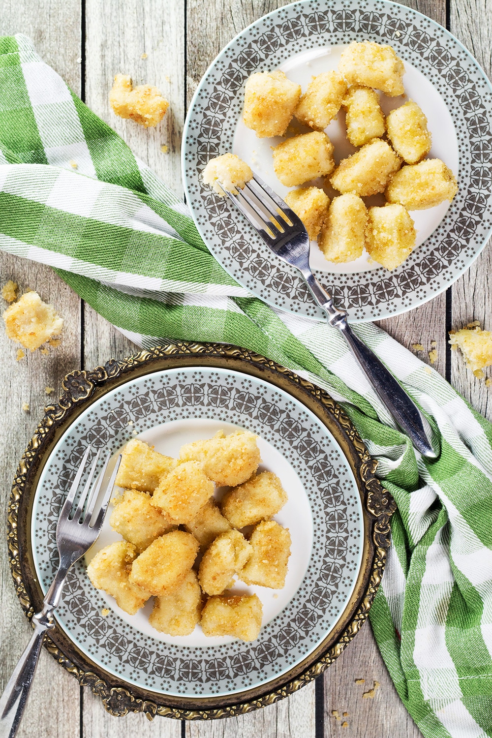 Shlishkes, or Hungarian Potato Dumplings, is a perfect side dish for everyone. These little guys are made with mashed potatoes and covered in buttered bread crumbs! | cookingtheglobe.com