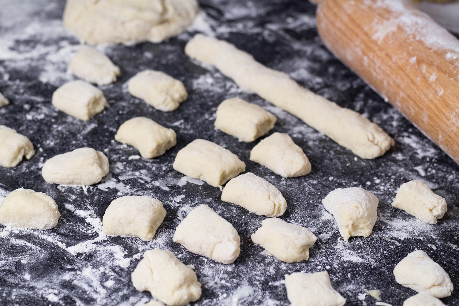 Shlishkes, or Hungarian Potato Dumplings, is a perfect side dish for everyone. These little guys are made with mashed potatoes and covered in buttered bread crumbs! | cookingtheglobe.com