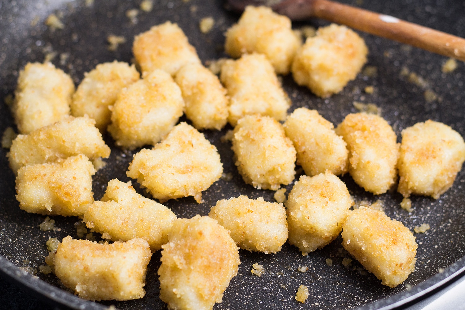 Shlishkes, or Hungarian Potato Dumplings, is a perfect side dish for everyone. These little guys are made with mashed potatoes and covered in buttered bread crumbs! | cookingtheglobe.com