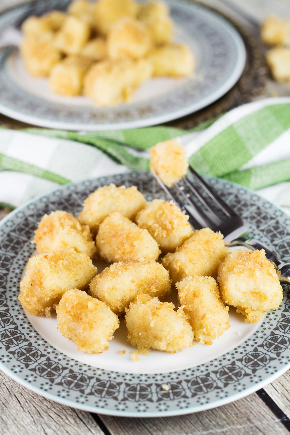 Shlishkes, or Hungarian Potato Dumplings, is a perfect side dish for everyone. These little guys are made with mashed potatoes and covered in buttered bread crumbs! | cookingtheglobe.com