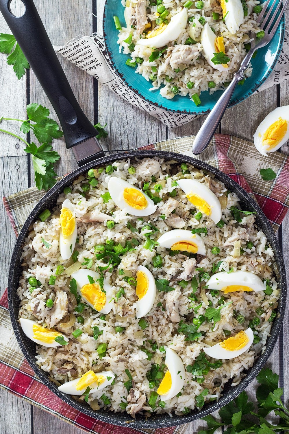 Kedgeree is a traditional British dish usually eaten for breakfast. Smoked fish, spiced rice, peas, onions, and hard-boiled eggs. A true flavor bomb! | cookingtheglobe.com