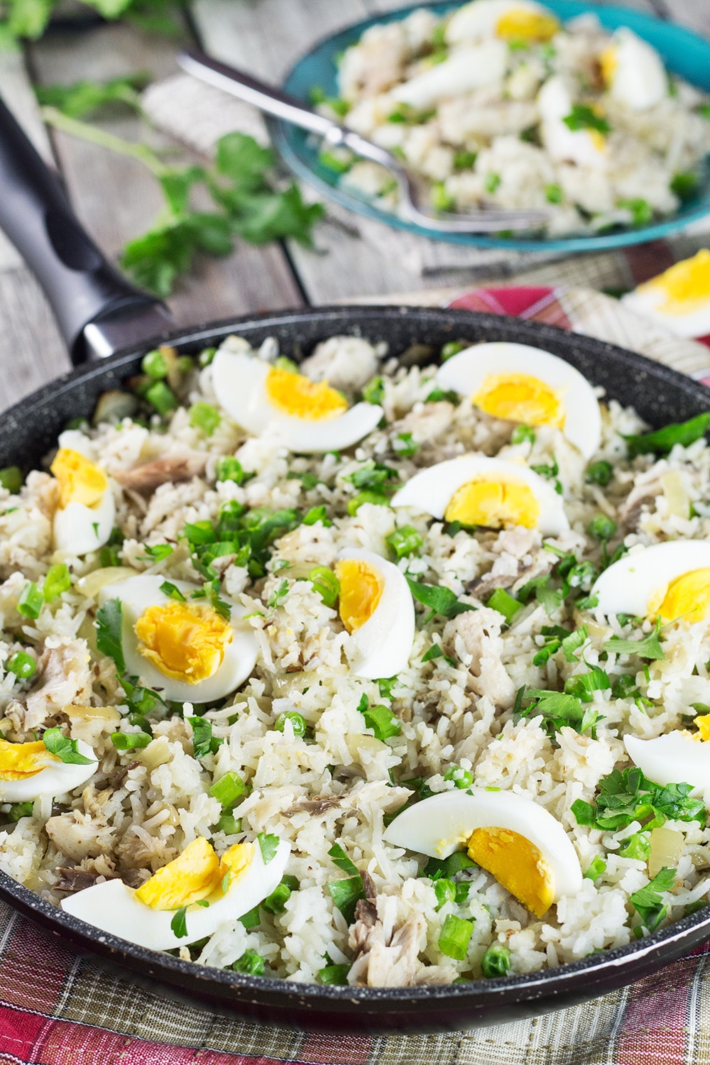 Kedgeree is a traditional British dish usually eaten for breakfast. Smoked fish, spiced rice, peas, onions, and hard-boiled eggs. A true flavor bomb! | cookingtheglobe.com