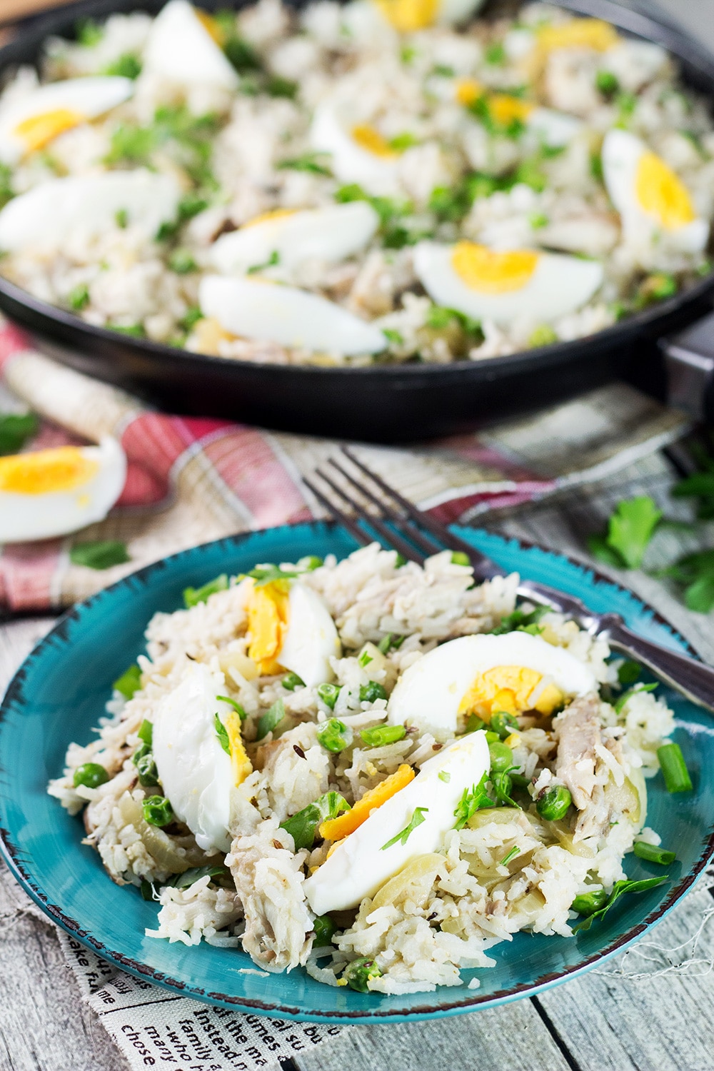 Kedgeree is a traditional British dish usually eaten for breakfast. Smoked fish, spiced rice, peas, onions, and hard-boiled eggs. A true flavor bomb! | cookingtheglobe.com