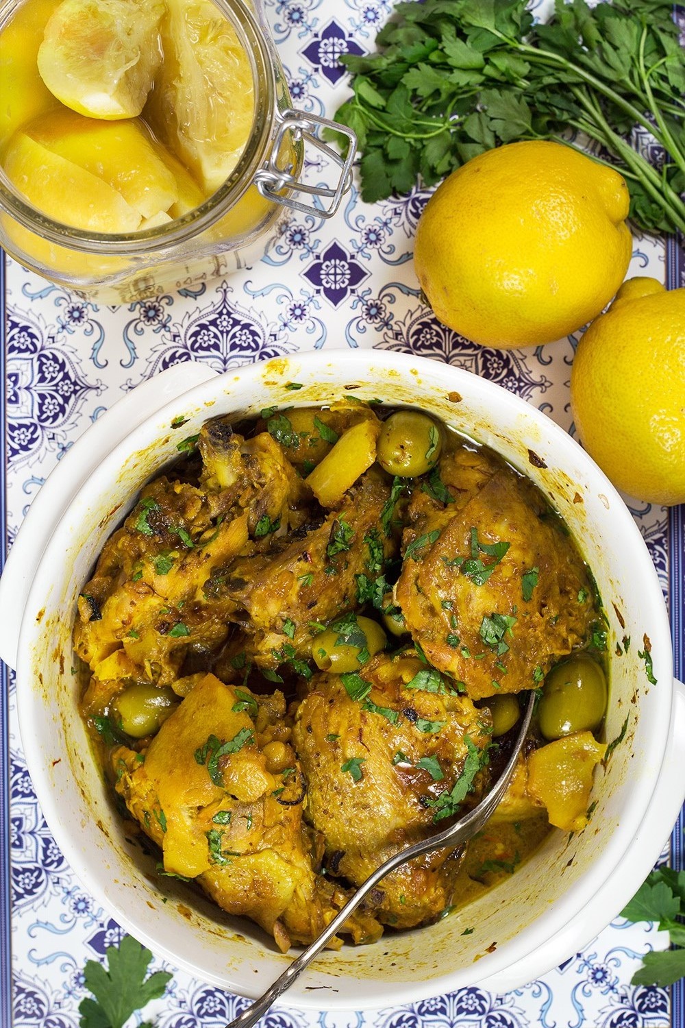 This Moroccan Chicken Tagine is bursting with flavor! Infused with saffron and flavored with preserved lemons, it's guaranteed to become your favorite! | cookingtheglobe.com