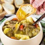 Soup Joumou is a traditional Haitian pumpkin soup packed with 11 different veggies, beef, and pasta. Hearty, comforting, and crazy delicious! | cookingtheglobe.com