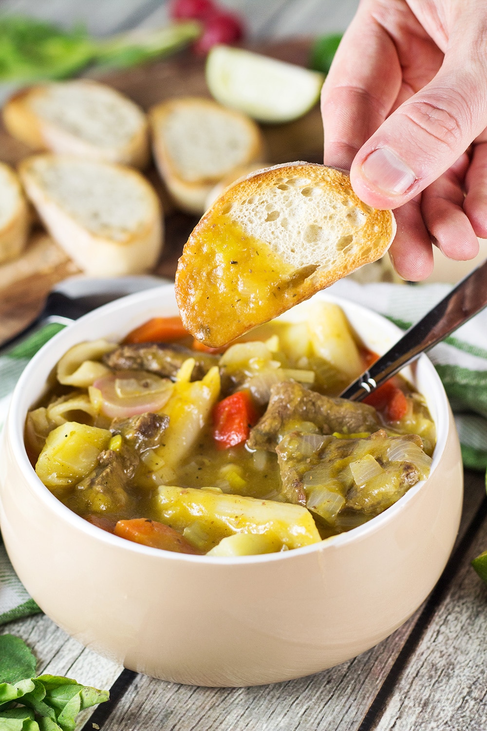 Soup Joumou is a traditional Haitian pumpkin soup packed with 11 different veggies, beef, and pasta. Hearty, comforting, and crazy delicious! | cookingtheglobe.com