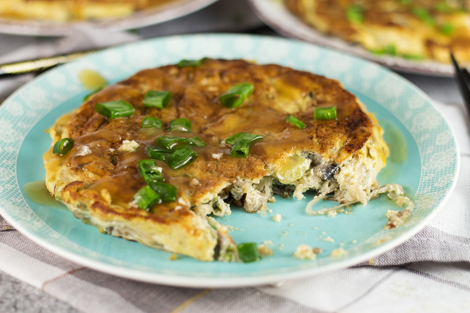 Vegetable Egg Foo Young is a perfect meatless Chinese-American breakfast option. Packed with bean sprouts, water chestnuts, and mushrooms! | cookingtheglobe.com