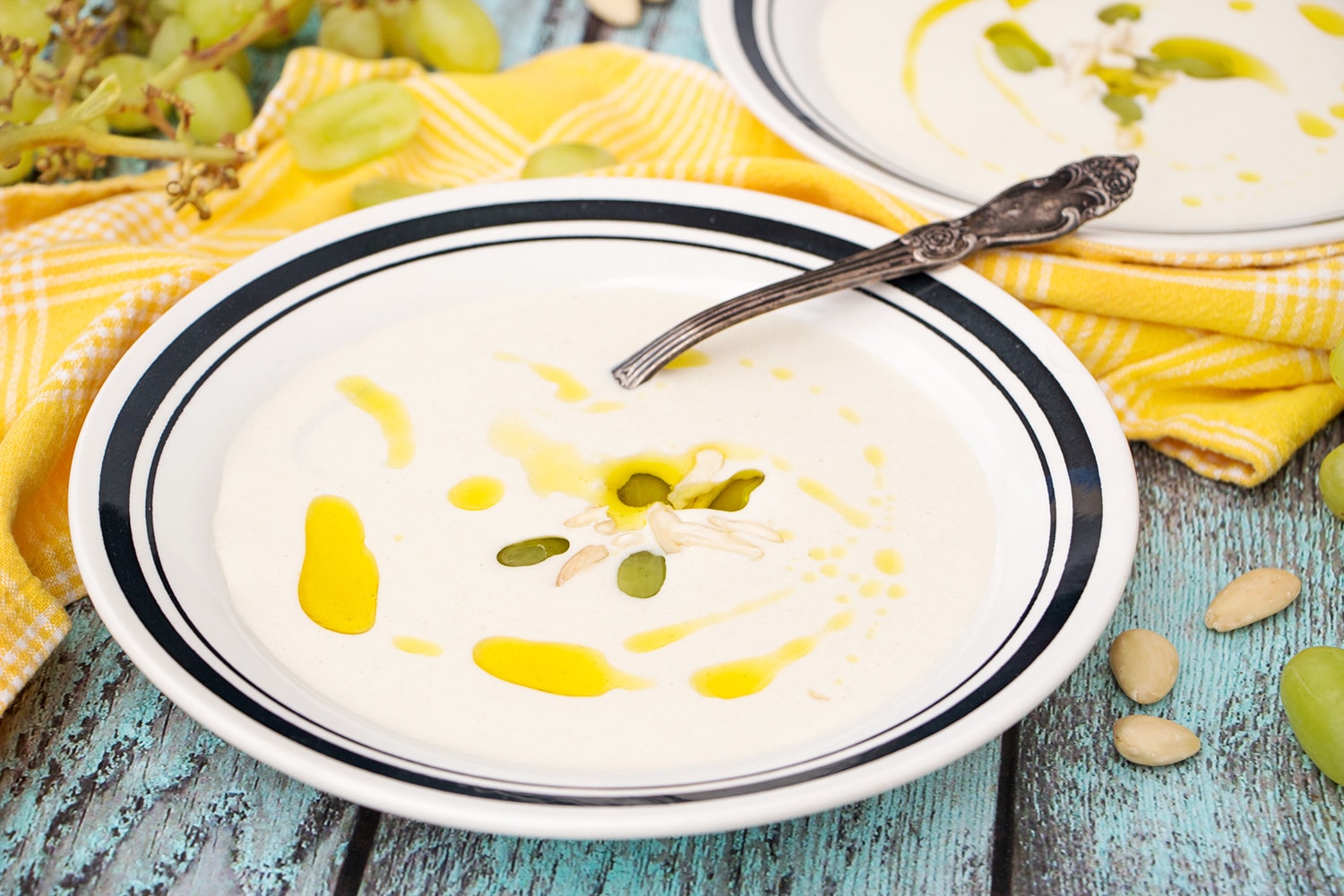 Ajo Blanco is your answer to the summer heat! Almonds, garlic, bread, olive oil, and grapes combined together to create this chilled Spanish soup! | cookingtheglobe.com