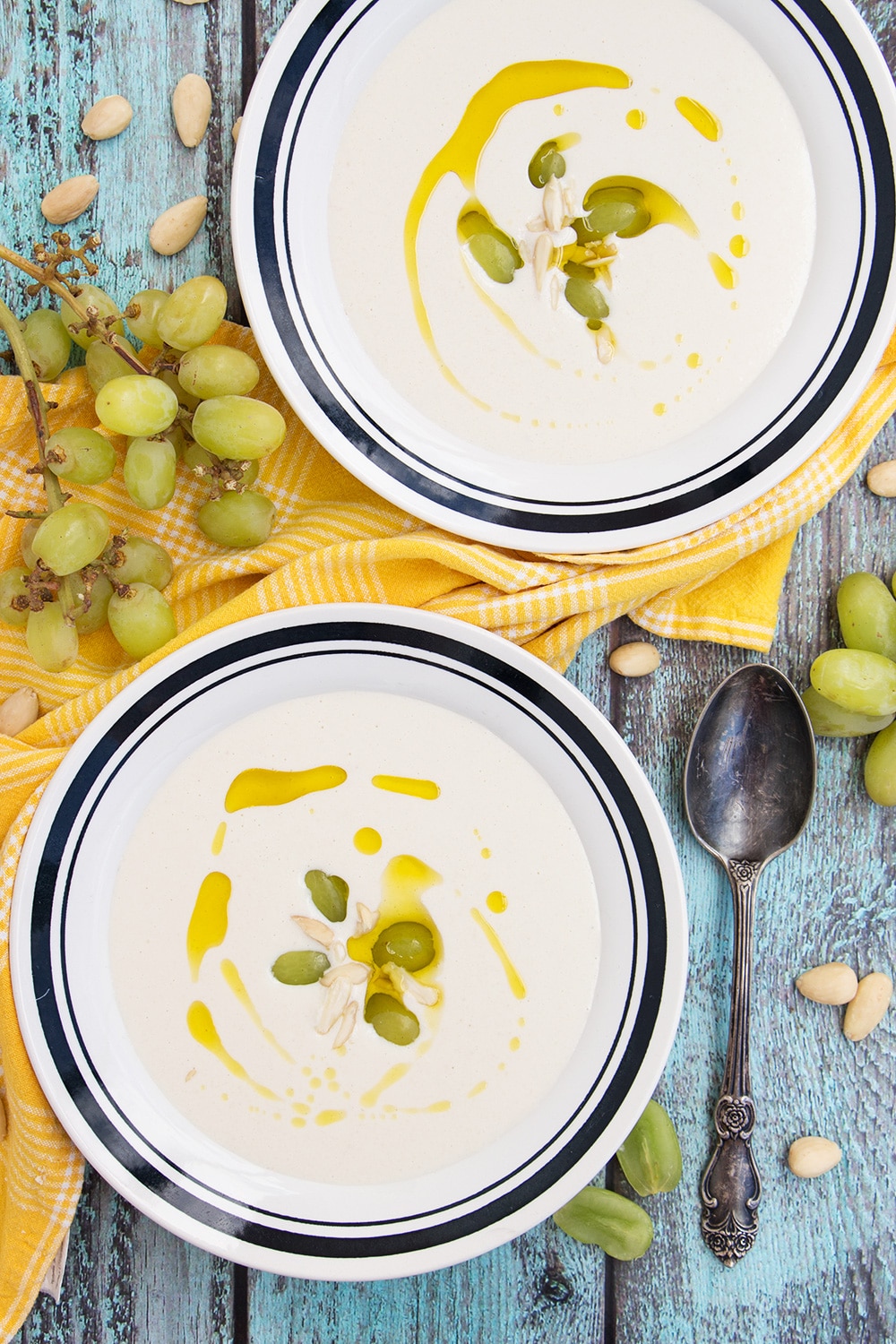 Ajo Blanco is your answer to the summer heat! Almonds, garlic, bread, olive oil, and grapes combined together to create this chilled Spanish soup! | cookingtheglobe.com