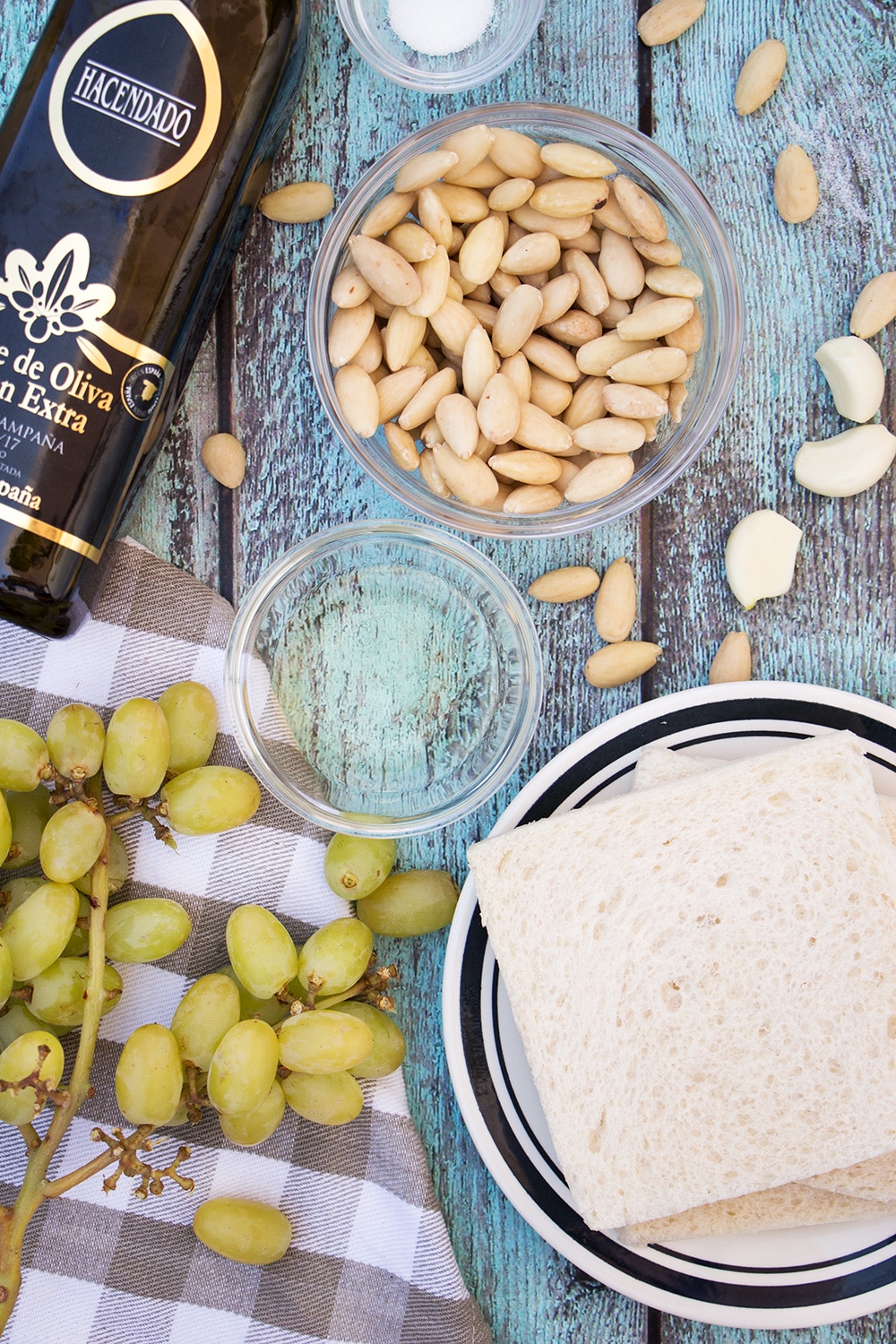 Ajo Blanco is your answer to the summer heat! Almonds, garlic, bread, olive oil, and grapes combined together to create this chilled Spanish soup! | cookingtheglobe.com