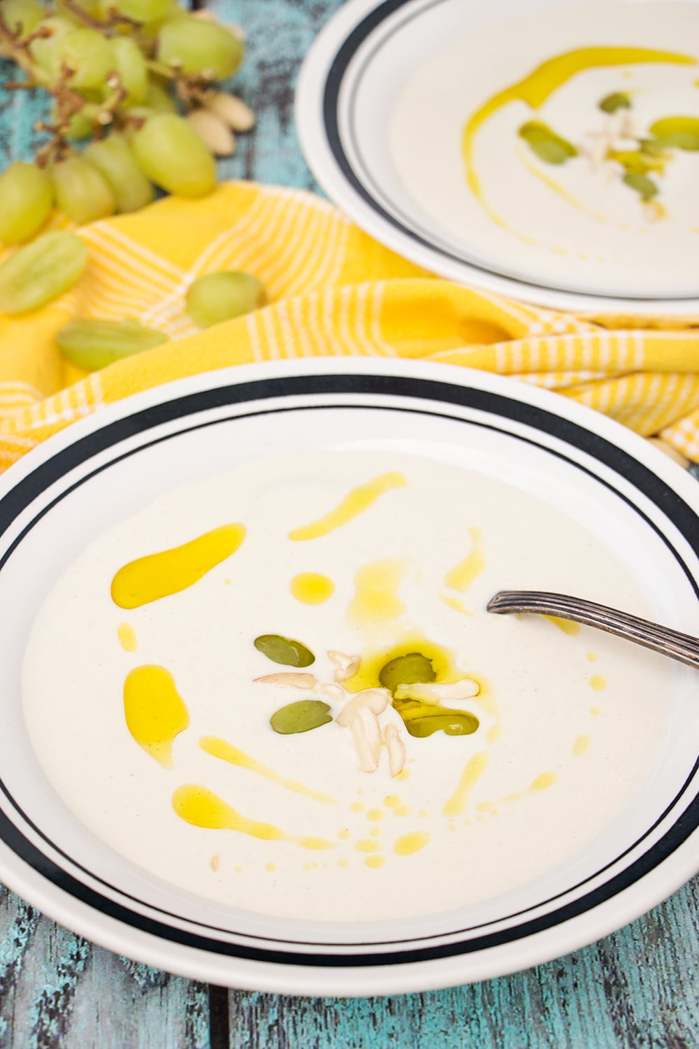 Ajo Blanco is your answer to the summer heat! Almonds, garlic, bread, olive oil, and grapes combined together to create this chilled Spanish soup! | cookingtheglobe.com