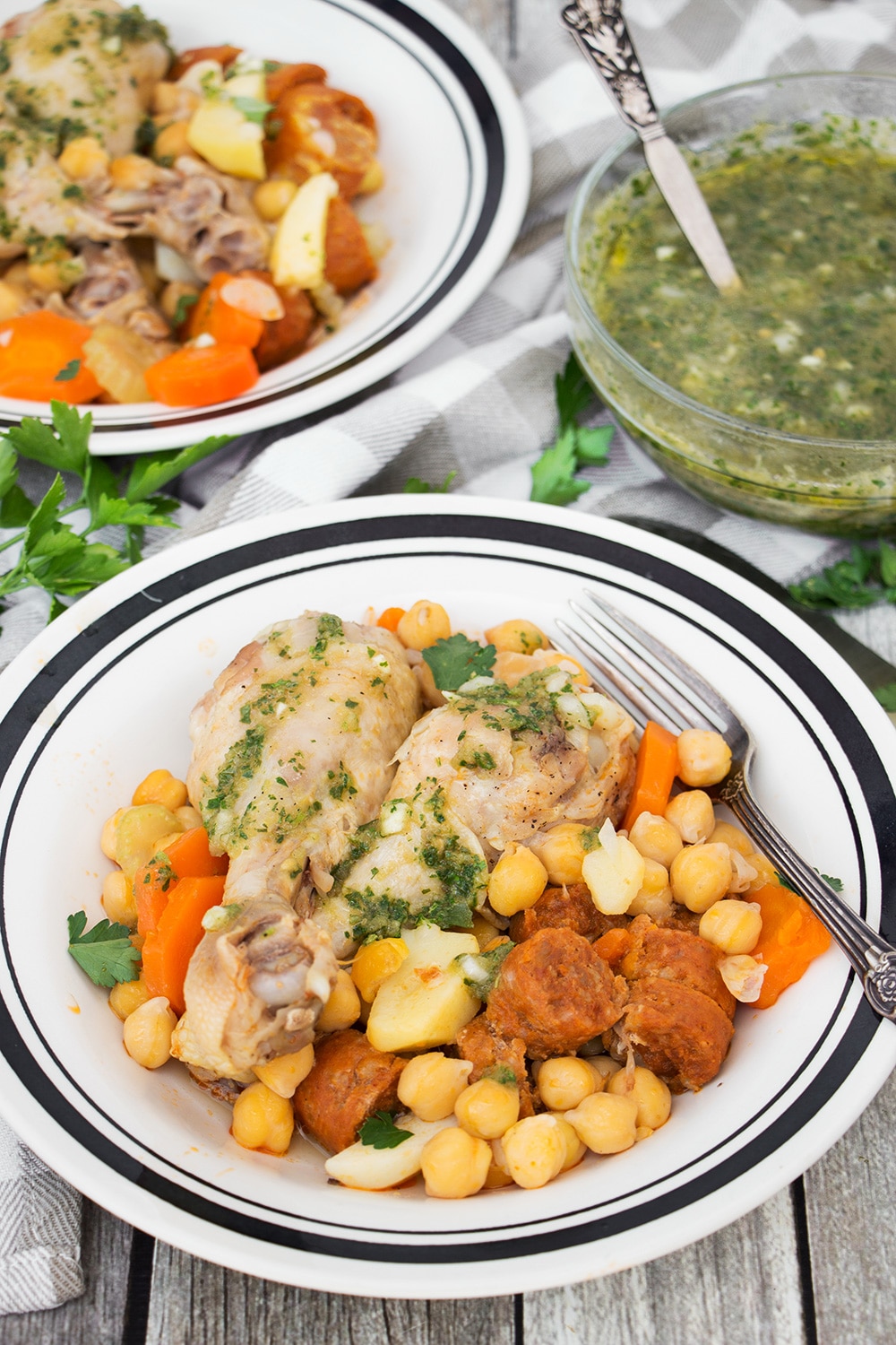 Cocido is one of the most iconic Spanish dishes. While this stew can be made numerous ways, my version features chicken, chorizo, chickpeas, and a bunch of veggies! | cookingtheglobe.com