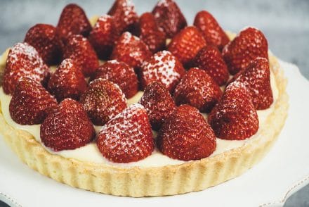 This French Strawberry Tart is literally the best thing you can make with fresh full-of-flavor strawberries. A buttery tart shell + custard + strawberries! | cookingtheglobe.com